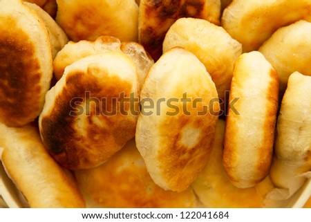 A lot of fried pies ruddy from wheat flour