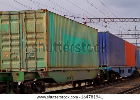 Transportation of containers by rail to freight trains