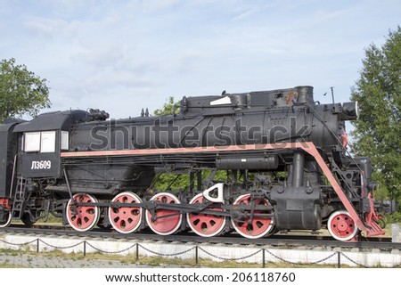 KARASUK, RUSSIA - JUNE 29: Monument Old locomotive, coal-fired on June 29, 2014 in Karasuk.