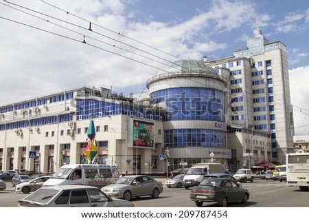 OMSK, RUSSIA - JULY 2: Busy street and house in the city of Omsk on July 2, 2014 in Omsk.