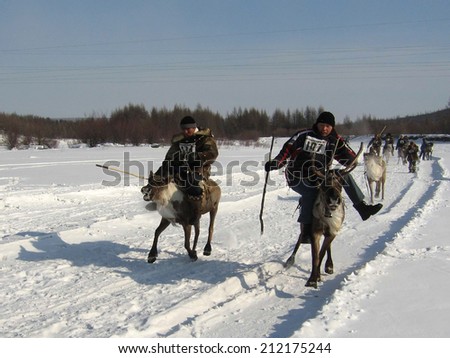 NERUNGRI, RUSSIA - MARCH 4: Racing on deer during the celebration of the reindeer herder in Yakutia on March 4, 2006 in Nerungri.