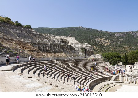 EPHESUS, TURKEY - JULY 7: Tourists on the benches and the stage of the ancient theater in Ephesus on July 07, 2014 in Ephesus.