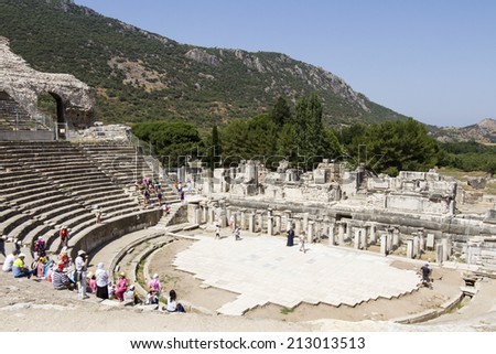 EPHESUS, TURKEY - JULY 7: Tourists on the benches and the stage of the ancient theater in Ephesus on July 07, 2014 in Ephesus.