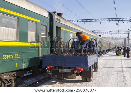 ULAN-UDE, RUSSIA - JANUARY 31: Loading of coal into wagons Chinese train at the station on January 31, 2015 in Ulan-Ude.