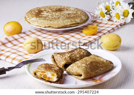 Pancakes with curd cheese and dried apricots