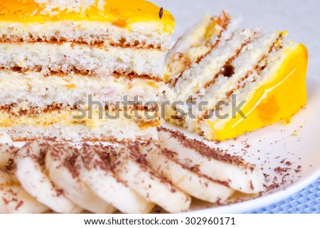 Delicious cake with banana jelly and banana slices, sprinkle with grated chocolate
