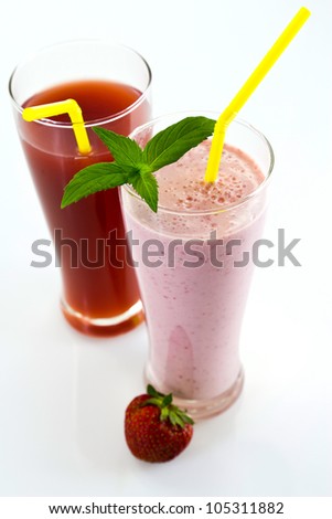 strawberry cocktail and juice with mint leaves, straw, fresh strawberries