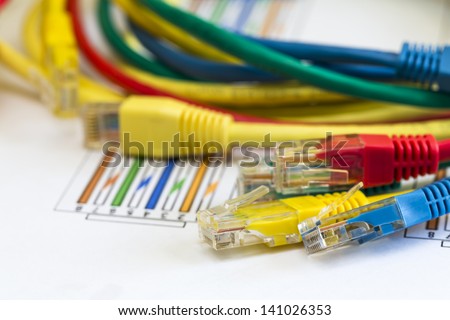 Termination of colored RJ45 cables for computer networks with instructions about the distribution of wire terminations