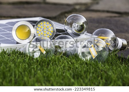 E27 tungsten, halogen and various LED bulbs on the grass; GU10 on solar panel