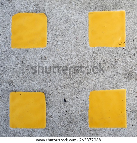 Real concrete mixed with yellow square ceramic texture background