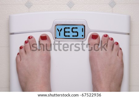 Digital Bathroom Scale Displaying YES Message