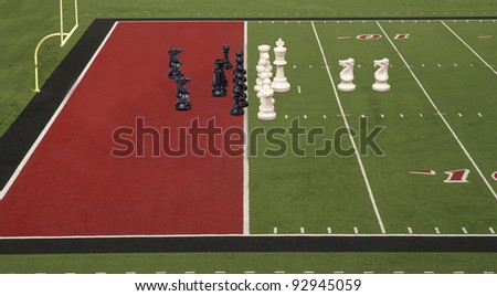 Chess pieces lined up like football teams on the goal line