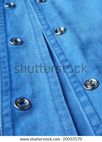 denim clothes fragment with buttons