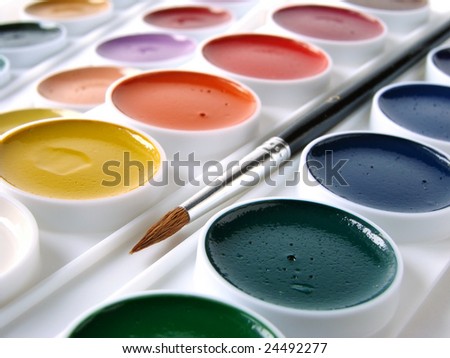 watercolor paints set with brush
