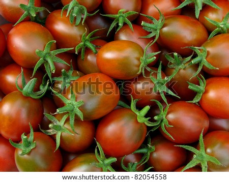 fresh cropped brown tomatoes with green calyxes