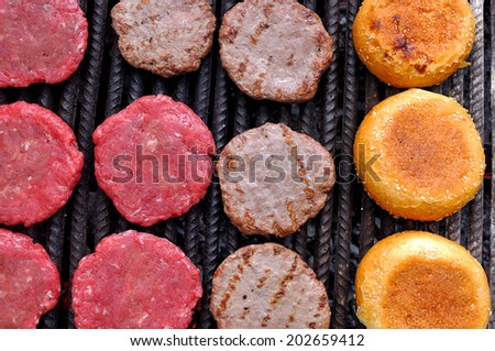 Outdoor cooking burgers on grill