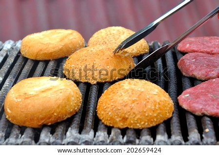 Outdoor cooking burgers on grill