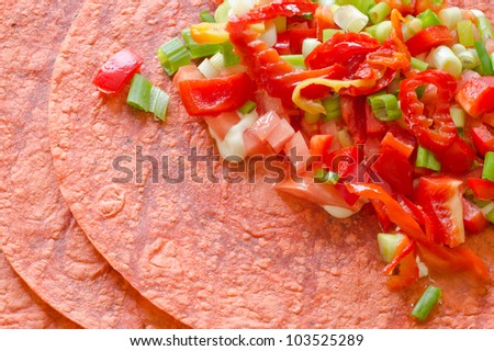 Tomato tortilla wraps with vegetable filling