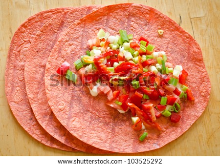 Tomato tortilla wraps with vegetarian filling