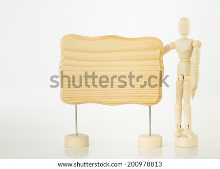 Wooden artist mannequin with a blank wooden sign for your message