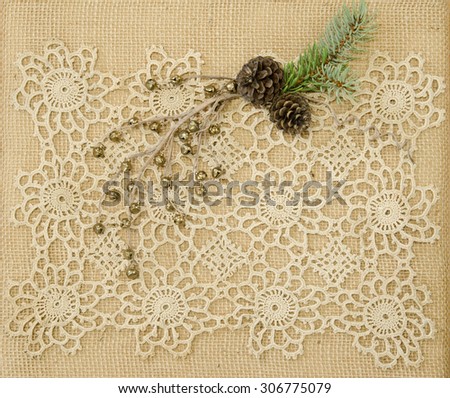 Burlap wrapped Christmas present with vintage lace doily