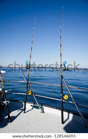 Rods for fishing in sunny morning at the boat in the ocean fishing