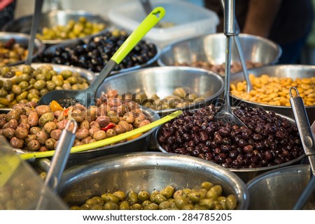 Pickled olive assortment on farmers market stall