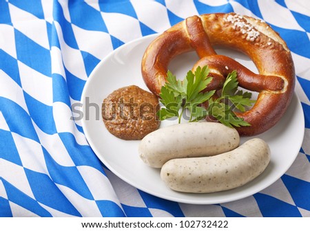 Bavarian white sausages with  sweet mustard and bretzels