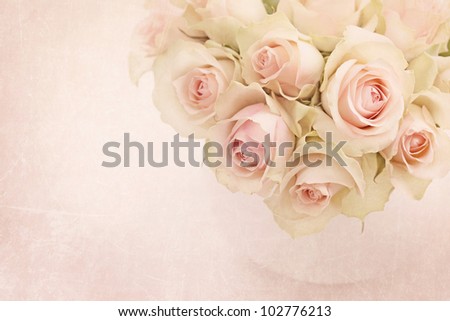 White roses  in a vase on white background