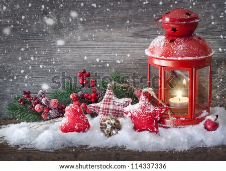 Burning lantern in the snow Burning lantern in the snow