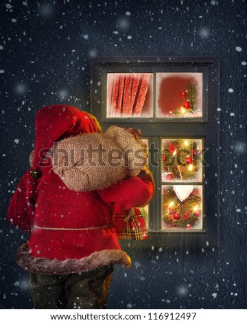 Santa Claus looking through a frosted window