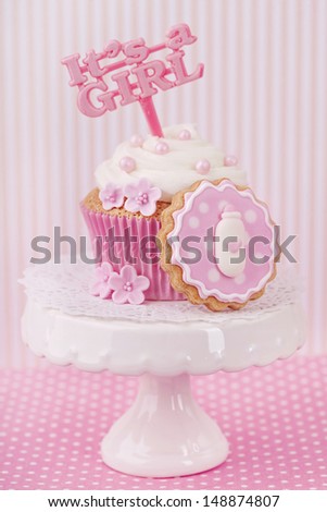 Cupcake with a cake pick on a stand