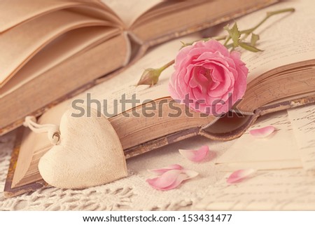 Pink flowers, letters and old books
