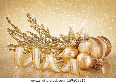 Christmas golden decoration  with balls and ribbon