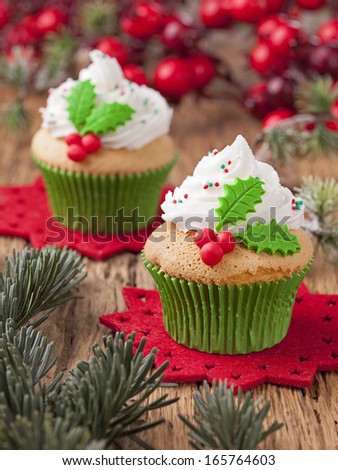 Christmas cup cakes with holly berry