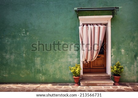 Colorful door of the home in Burano village