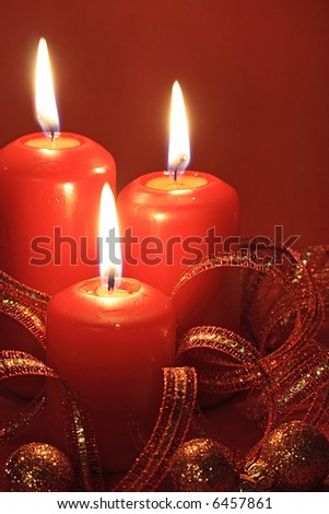 three candle on red background