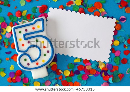 Number five birthday candle on blue background