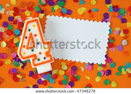 Number four birthday candle on orange background