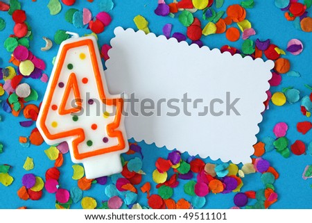 Number four birthday candle on blue background