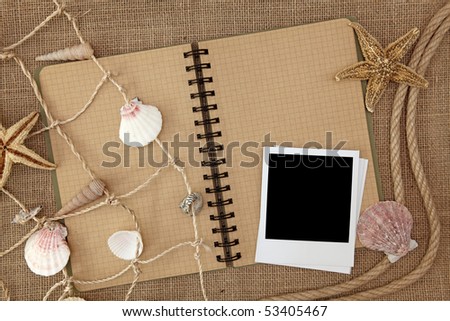 Fishing net and exercise book on brown background