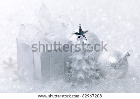 White christmas decoration on white snow background
