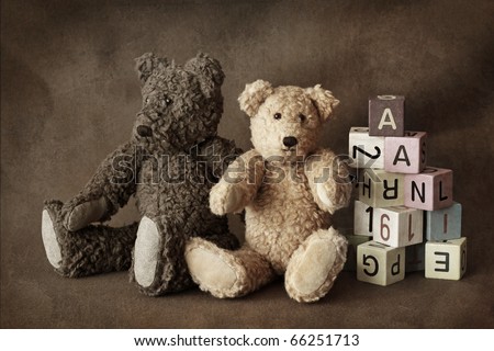 Teddy bears on brown background
