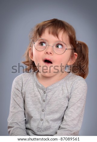 stock photo Fanny little girl with glasses on grey background girls fannys