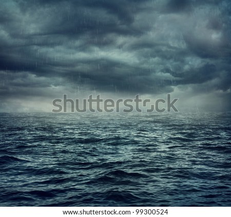 Rain over the stormy sea, abstract dark background.