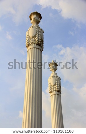 ancient greek pillars against a blue sky