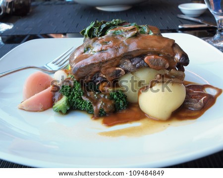 Braised short ribs served on a plate in a restaurant
