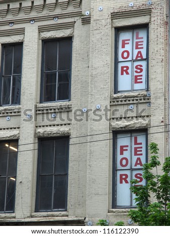 Lease sign in the window of a commercial or office property