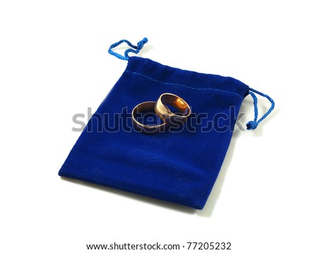 stock photo Two simple wedding rings on a blue velvet bag isolated over 