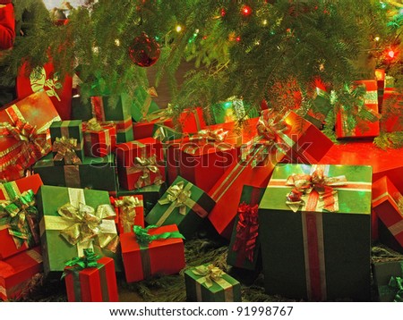 Christmas-themed wrapped gift boxes under the tree